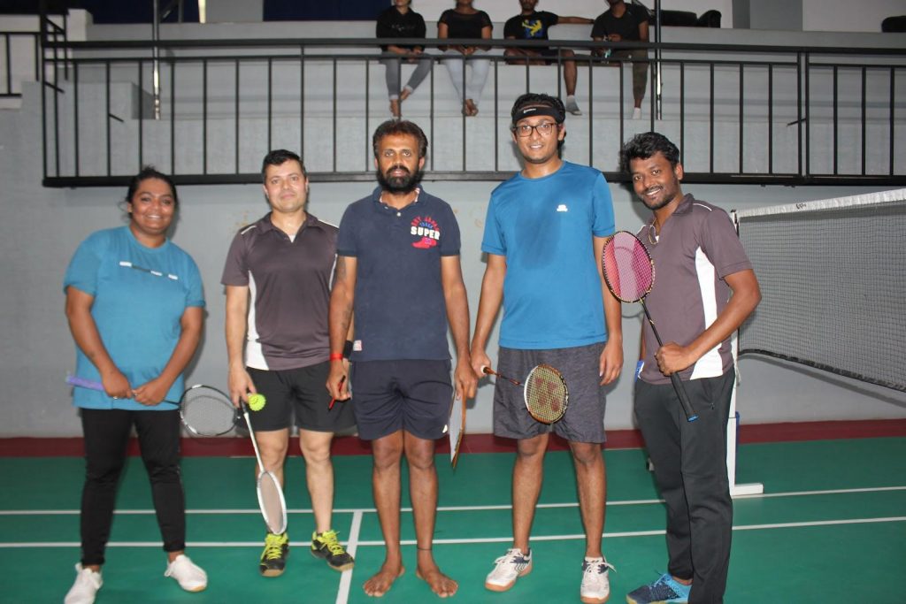 GlowRoad.com employees in an indoor court